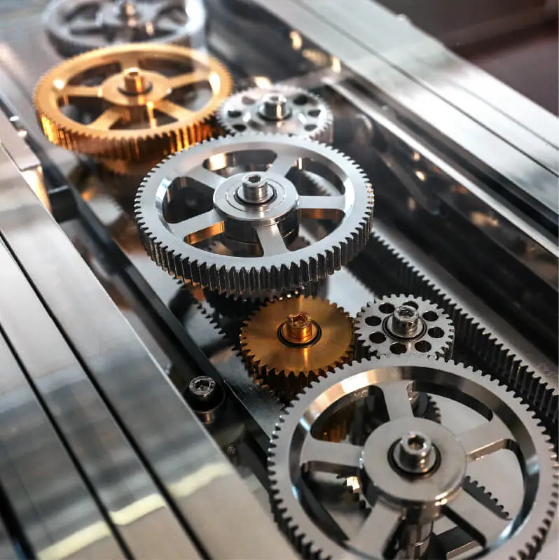 small and large silver and brass mechanical gears