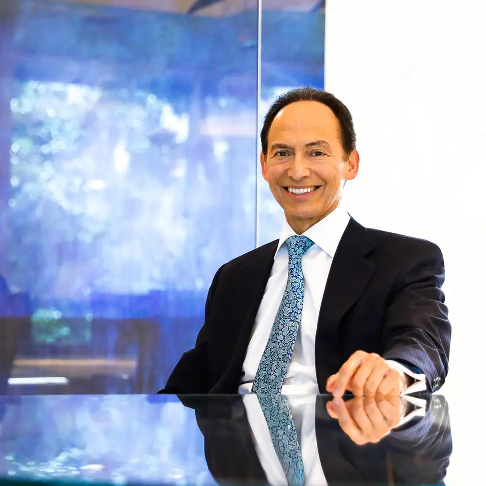 The Investment Counsel Company of Nevada President Randy Garcia, seated in his Las Vegas office.